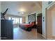Serene main bedroom with a comfortable bed, wood floors, and plenty of natural light at 80 S Laura Ln, Casa Grande, AZ 85194