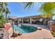 Backyard pool featuring a spa and covered patio with ample seating space at 80 S Laura Ln, Casa Grande, AZ 85194