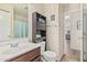 Well-maintained bathroom with a modern vanity and convenient storage shelving at 914 E Pedro Rd, Phoenix, AZ 85042