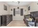 Warm Bedroom with wood floors, a dark wood crib, and dresser, offering comfort at 914 E Pedro Rd, Phoenix, AZ 85042