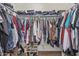 Walk-in closet with ample storage space for clothes and shoes, enhancing organization at 914 E Pedro Rd, Phoenix, AZ 85042