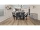 The open dining area boasts wood floors and a view of the kitchen at 914 E Pedro Rd, Phoenix, AZ 85042