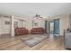 Open-concept living area with wood floors and comfortable seating arrangements at 914 E Pedro Rd, Phoenix, AZ 85042