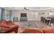 Open-concept living area with wood floors and comfortable seating arrangements at 914 E Pedro Rd, Phoenix, AZ 85042