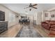 Bright, open-concept living room and dining area, features wood floors and stylish decor at 914 E Pedro Rd, Phoenix, AZ 85042