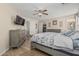 Main bedroom features a ceiling fan, walk-in closet, and wood-look flooring at 914 E Pedro Rd, Phoenix, AZ 85042