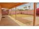 Backyard featuring a covered patio with stone features, perfect for outdoor living and dining at 10603 W Ruth Ave, Peoria, AZ 85345