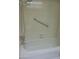Bathroom features a shower/tub combo with a detachable shower head and grab bar at 10603 W Ruth Ave, Peoria, AZ 85345