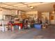 Well-lit garage interior with storage shelves and functional workspace at 10603 W Ruth Ave, Peoria, AZ 85345