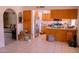 Open-concept kitchen with stainless steel appliances and abundant cabinetry at 10603 W Ruth Ave, Peoria, AZ 85345