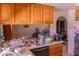 Kitchen with wooden cabinets and stainless-steel refrigerator at 10603 W Ruth Ave, Peoria, AZ 85345