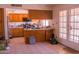 Bright kitchen with an island and access to the backyard at 10603 W Ruth Ave, Peoria, AZ 85345