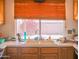 Kitchen sink and faucet complemented by light-colored countertops at 10603 W Ruth Ave, Peoria, AZ 85345