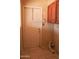 Functional laundry area with access door and cabinet storage at 10603 W Ruth Ave, Peoria, AZ 85345