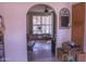 Open archway reveals the dining room with shuttered windows at 10603 W Ruth Ave, Peoria, AZ 85345