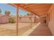 Covered patio looking out onto the backyard, featuring a shed with a brick patio and desert landscaping at 10603 W Ruth Ave, Peoria, AZ 85345