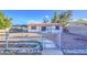 The backyard has decorative rock landscaping and block fence at 10917 W Apache St, Avondale, AZ 85323