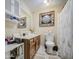 Bathroom featuring vanity, mirror, toilet and decorative shower curtain at 10917 W Apache St, Avondale, AZ 85323