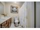 Bathroom featuring vanity, mirror, toilet and decorative shower curtain at 10917 W Apache St, Avondale, AZ 85323