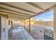 View of covered patio with refrigerator and grill, providing an ideal setting for outdoor cooking and social gatherings at 10917 W Apache St, Avondale, AZ 85323