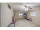 Spacious living area with tile flooring, ceiling fan, and plenty of room for activities at 10917 W Apache St, Avondale, AZ 85323