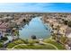 Picturesque aerial view of waterfront homes with lush landscaping and private boat docks at 1101 N Peppertree Dr, Gilbert, AZ 85234