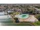 Expansive aerial perspective of a luxurious community showcasing the lagoon, pool, and lush surroundings at 1101 N Peppertree Dr, Gilbert, AZ 85234
