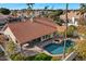 Aerial view of backyard featuring pool, patio, and well-manicured landscaping ideal for outdoor entertaining at 1101 N Peppertree Dr, Gilbert, AZ 85234