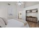 Bedroom with vaulted ceilings, neutral decor, and ample closet space for organized storage at 1101 N Peppertree Dr, Gilbert, AZ 85234
