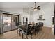 Open-concept dining room with access to the patio and views of the fireplace at 1101 N Peppertree Dr, Gilbert, AZ 85234