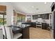 The kitchen features dark cabinets, granite countertops, bar seating, and stainless steel appliances at 1101 N Peppertree Dr, Gilbert, AZ 85234