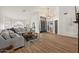 Open living room with a large sofa, fireplace, and arched windows at 1101 N Peppertree Dr, Gilbert, AZ 85234