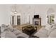 Bright and spacious living room with a fireplace and comfortable sofa at 1101 N Peppertree Dr, Gilbert, AZ 85234