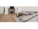 Comfortable living room with a cozy sofa and a stone fireplace at 1101 N Peppertree Dr, Gilbert, AZ 85234