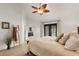 Bright bedroom with a ceiling fan, wood floors, and access to the backyard pool at 1101 N Peppertree Dr, Gilbert, AZ 85234