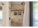 Contemporary shower with stone tilework, a built-in bench, and decorative shower accessories at 1101 N Peppertree Dr, Gilbert, AZ 85234