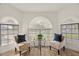 Charming sitting area with decorative windows and elegant seating at 1101 N Peppertree Dr, Gilbert, AZ 85234