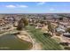 Golf course community aerial showcasing lush greenery, a serene lake, and well-maintained landscapes at 11444 S 51St St, Phoenix, AZ 85044