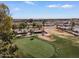 Community aerial view with mature trees, lush landscaping, and nearby commercial area including an IKEA at 11444 S 51St St, Phoenix, AZ 85044