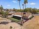 Spacious backyard featuring artificial turf and a screened-in porch, perfect for outdoor living at 11444 S 51St St, Phoenix, AZ 85044
