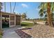Charming backyard featuring artificial turf, stone landscaping, and a cozy patio swing at 11444 S 51St St, Phoenix, AZ 85044