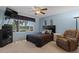 Bedroom with a ceiling fan, large window, and an armchair at 11444 S 51St St, Phoenix, AZ 85044