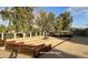 Outdoor bocce ball court with benches and manicured landscaping offers outdoor fun and a social gathering space at 11444 S 51St St, Phoenix, AZ 85044