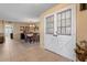 Inviting dining room with table set for a meal and grand double-door entrance at 11444 S 51St St, Phoenix, AZ 85044