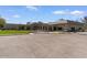 Attractive commercial building with desert landscaping, and golf cart parking space at 11444 S 51St St, Phoenix, AZ 85044