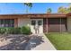Inviting front entrance features double doors, manicured landscaping, and a well-lit walkway to the home at 11444 S 51St St, Phoenix, AZ 85044
