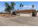 Charming single-story home with desert landscaping, mature trees, and a large driveway leading to the two-car garage at 11444 S 51St St, Phoenix, AZ 85044