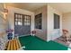 Charming front porch with seating, decorative plants, and classic double-door entry at 11444 S 51St St, Phoenix, AZ 85044
