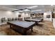 Game room features pool tables, chairs, and entertainment options for residents' enjoyment at 11444 S 51St St, Phoenix, AZ 85044