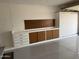 Well-organized garage with epoxy flooring, storage cabinets, and ample workspace at 11444 S 51St St, Phoenix, AZ 85044